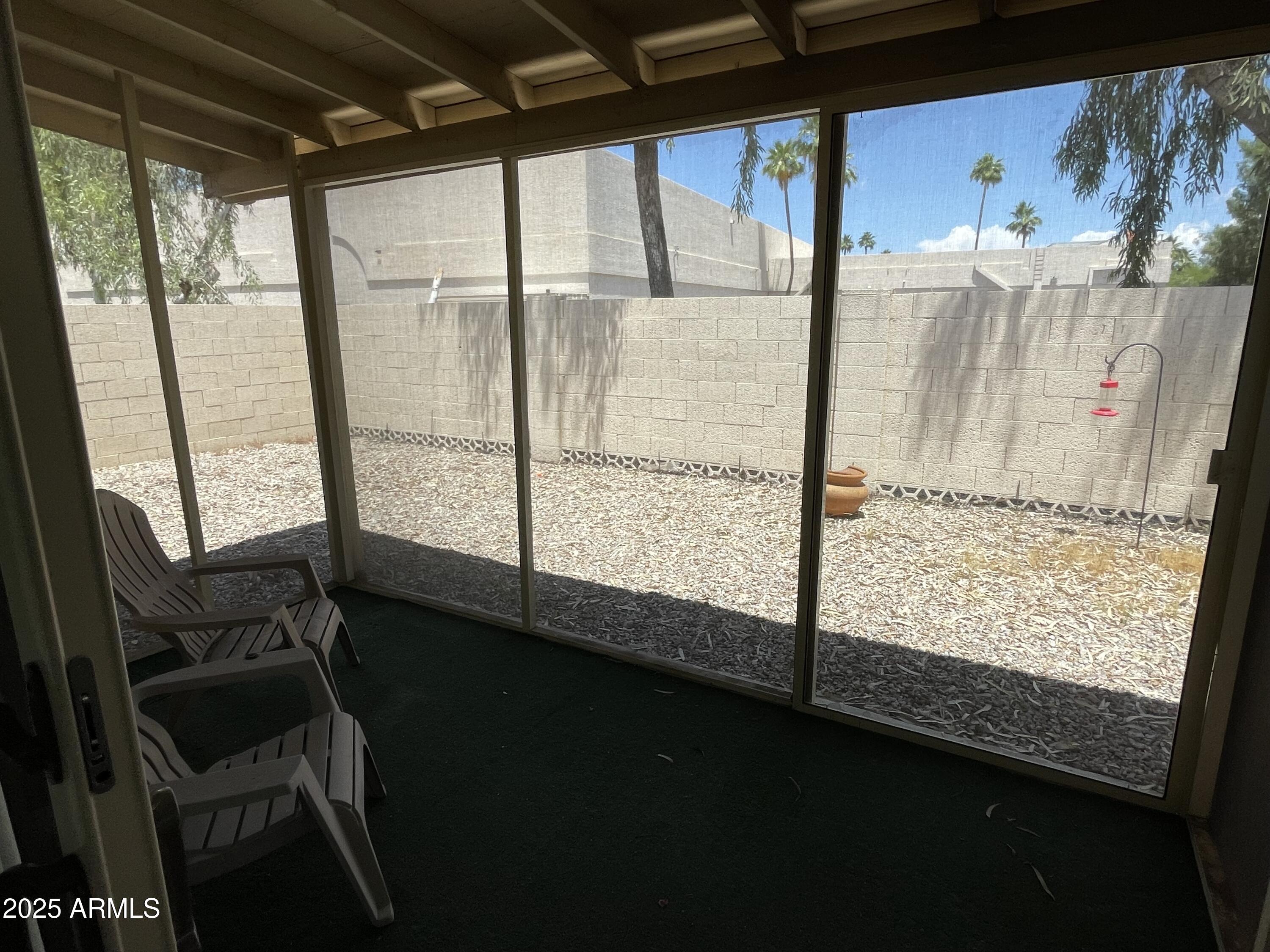732 West Rice Drive Tempe, AZ 85283 - Photo 17 of 18 a view of a room with wooden floor and windows