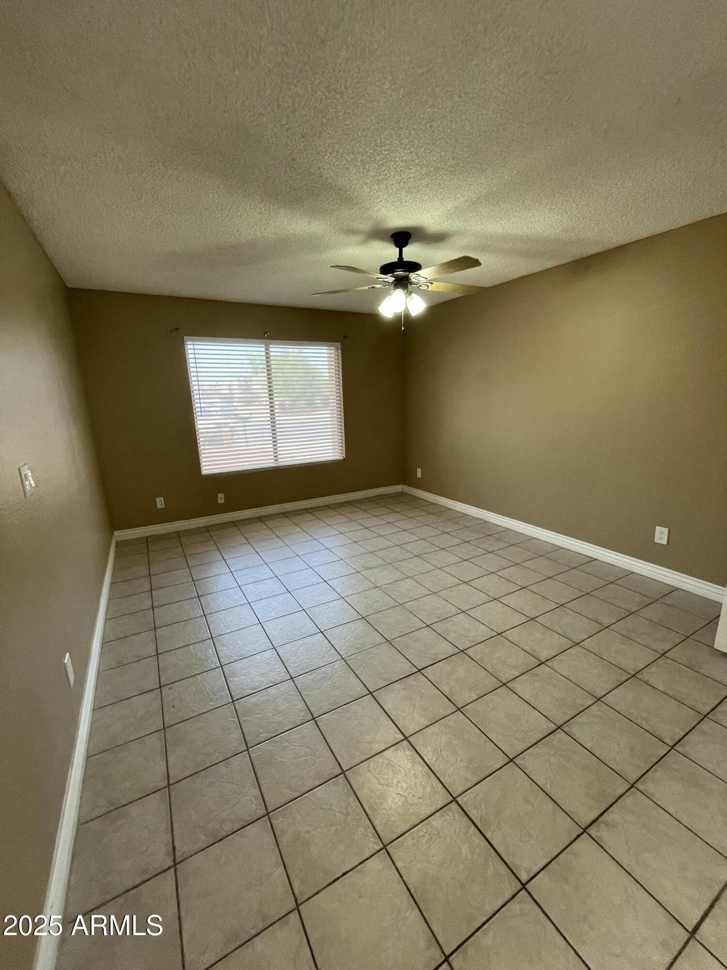 732 West Rice Drive Tempe, AZ 85283 - Photo 8 of 18 an empty room with windows