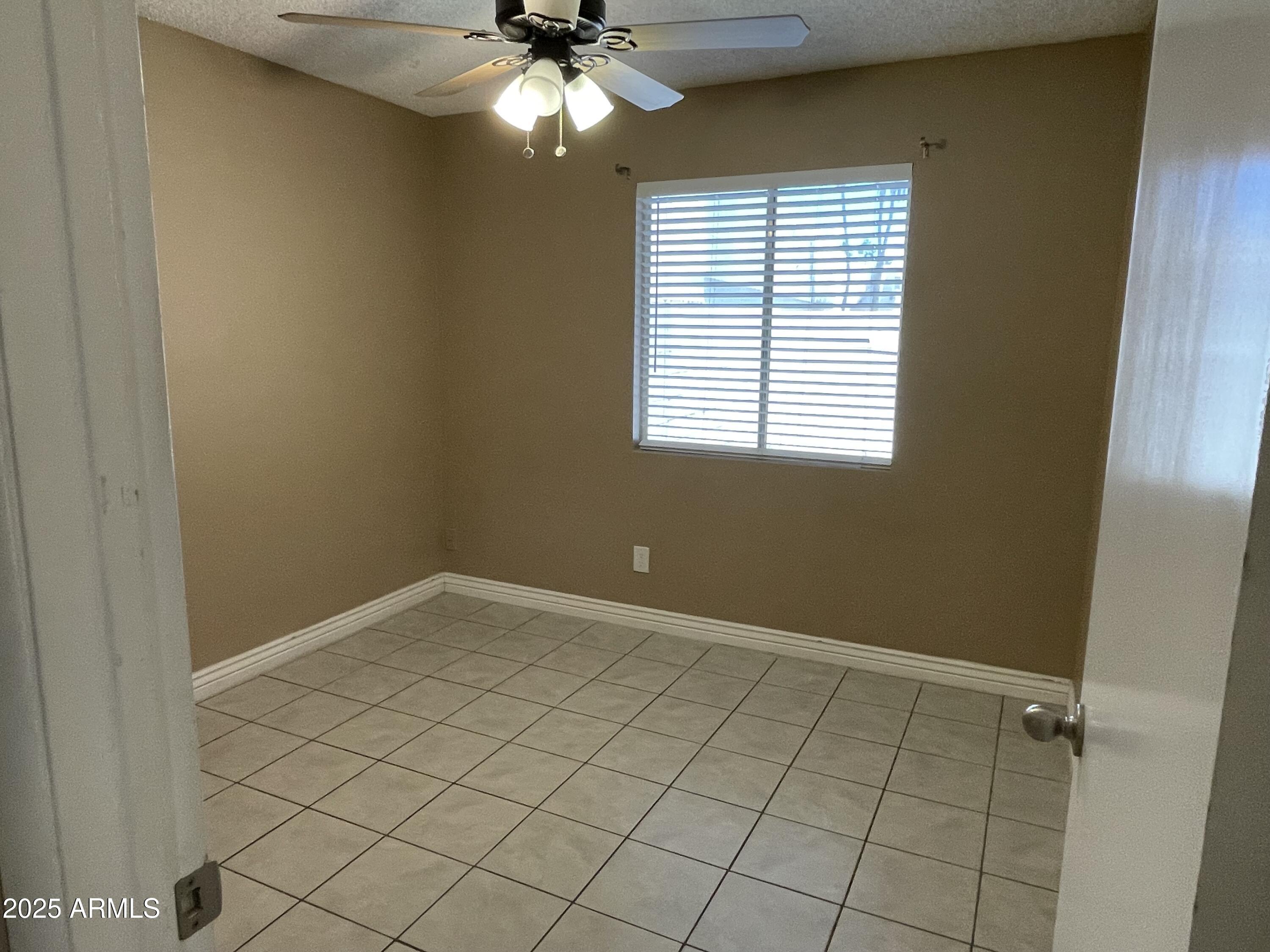 732 West Rice Drive Tempe, AZ 85283 - Photo 10 of 18 a view of an empty room and window
