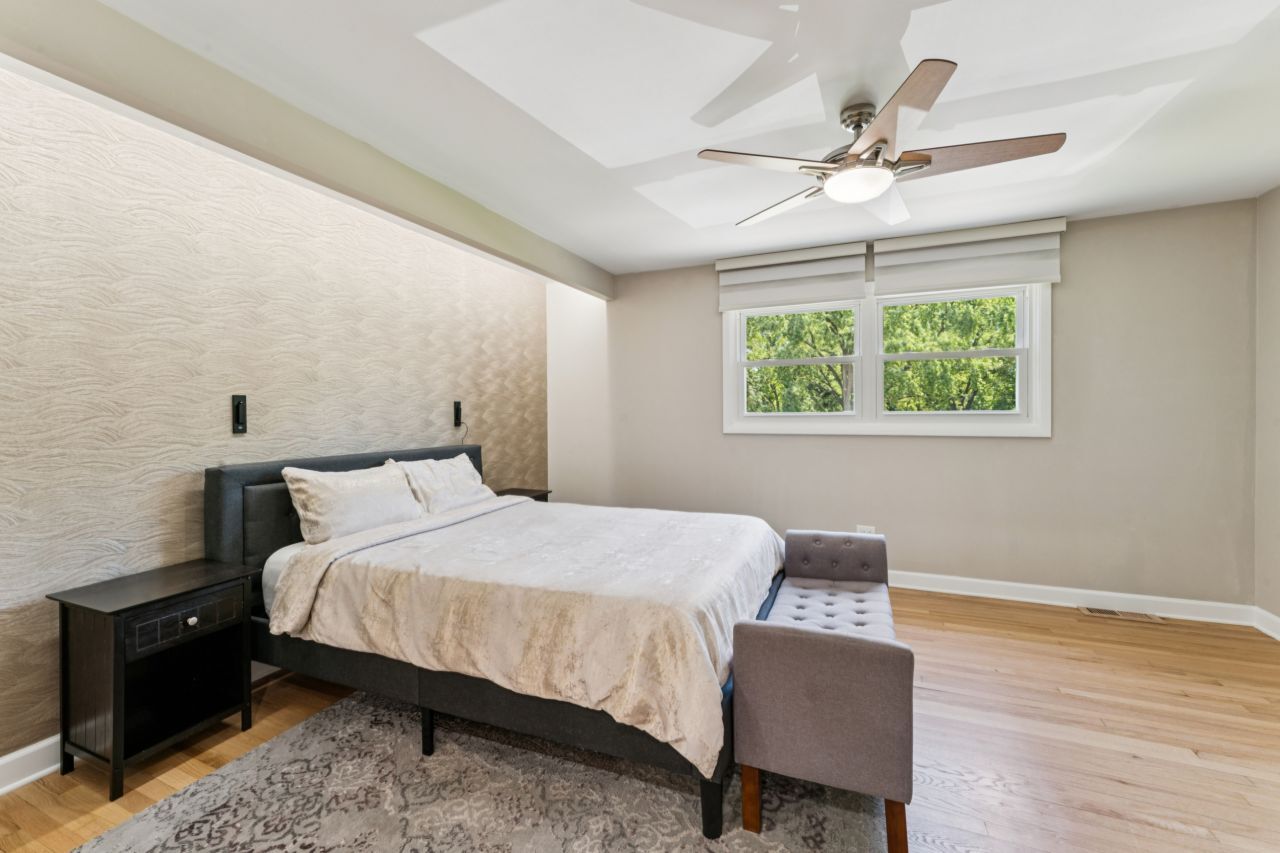 328 Windsor Lane Inverness, IL 60010 - Photo 11 of 33 a bedroom with a bed wooden floor and window