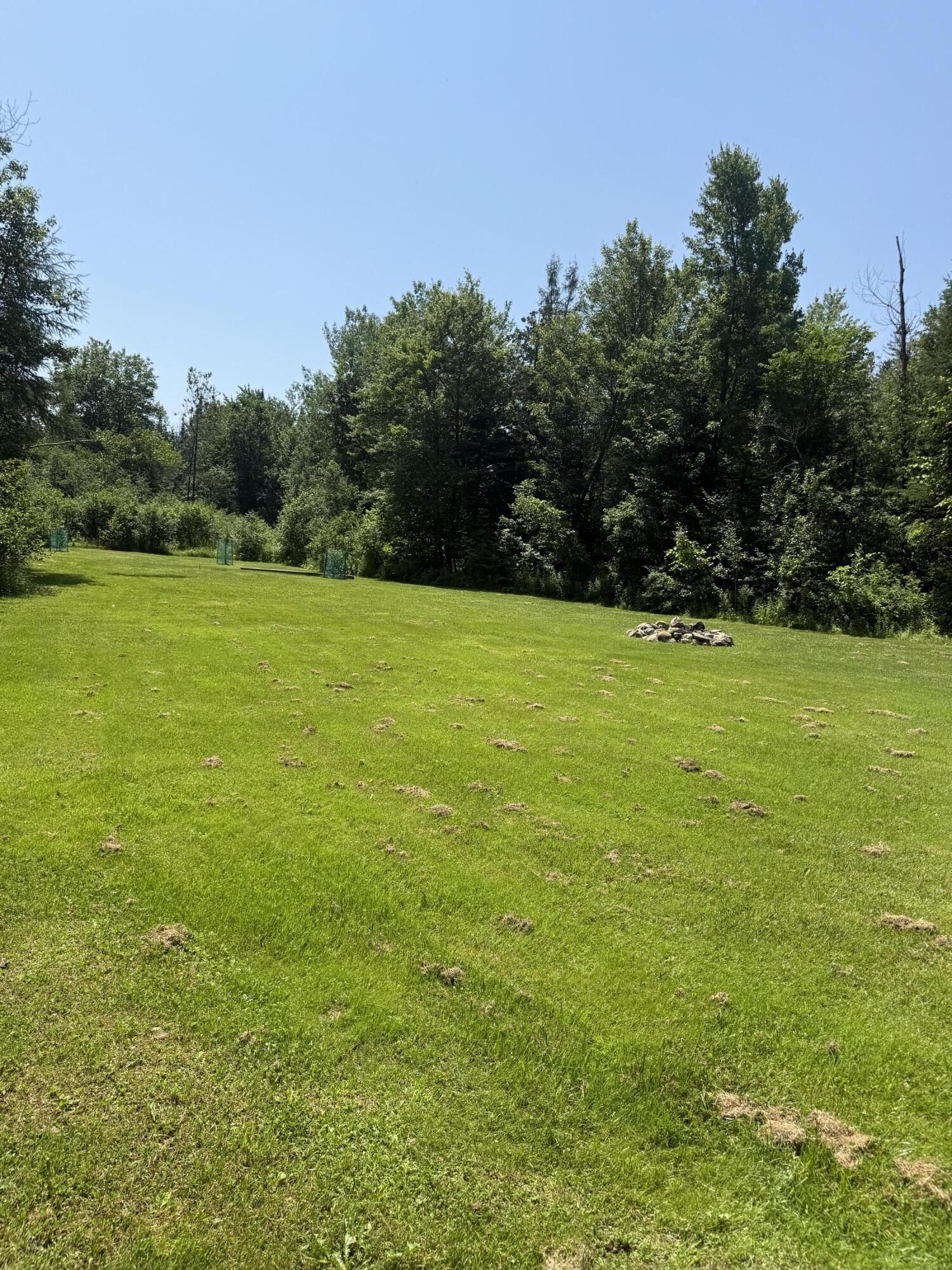 161 Bond Road Corinna, ME 04928 - Photo 3 of 39 back yard- lawn