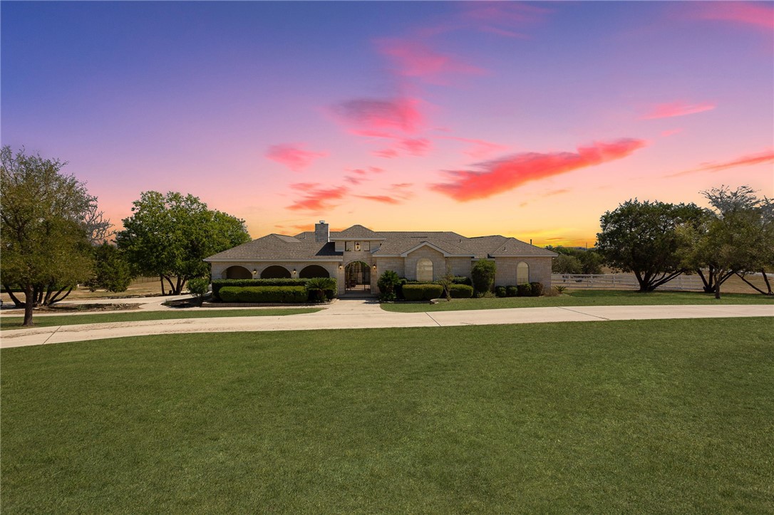 a house with swimming pool in front of it