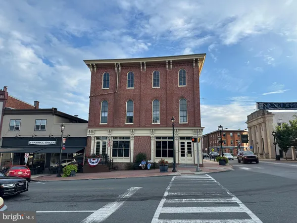 a view of a building with a street