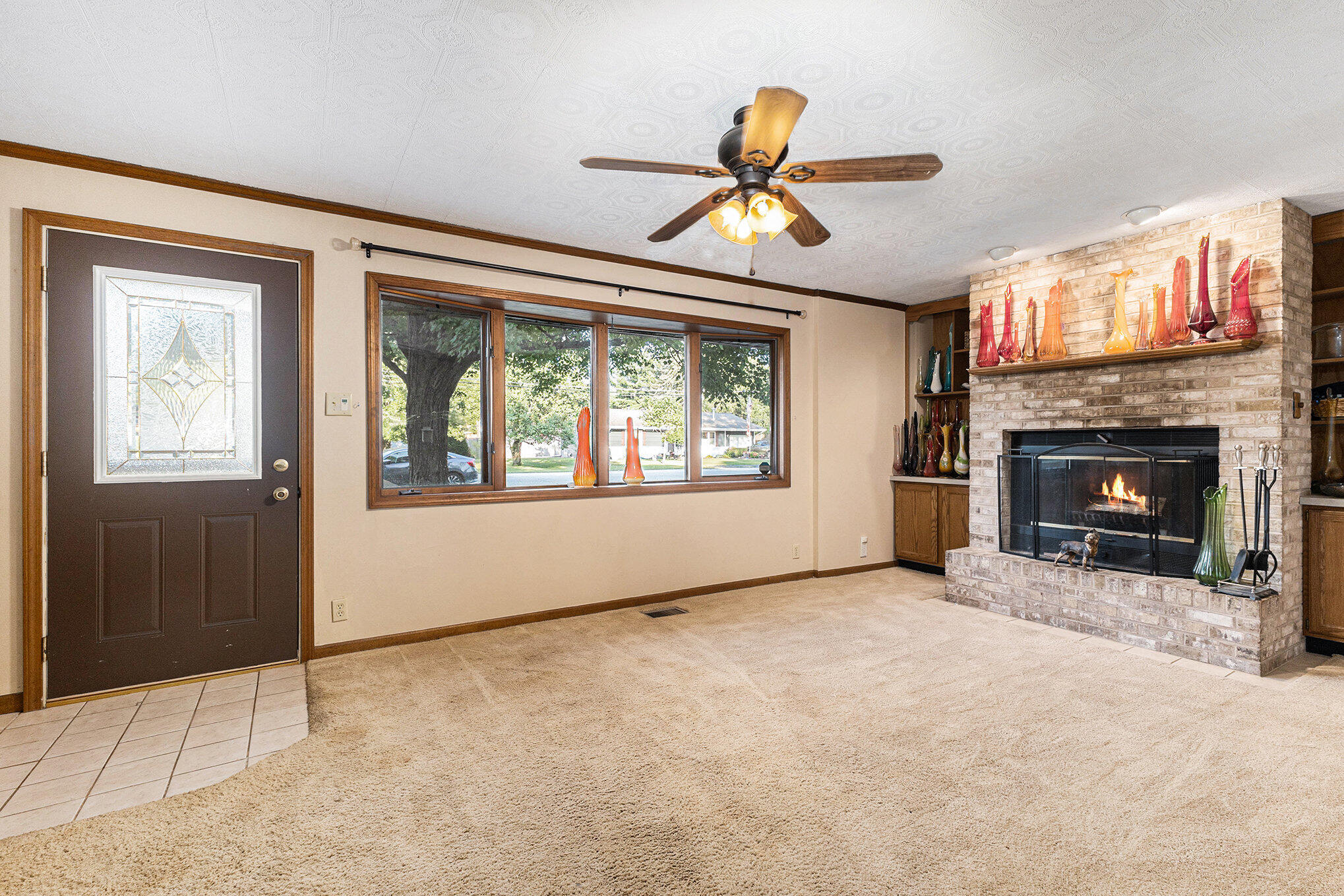 520 Johnson Road Michigan City, IN 46360 - Photo 3 of 11 a view of an empty room with a fireplace and a window