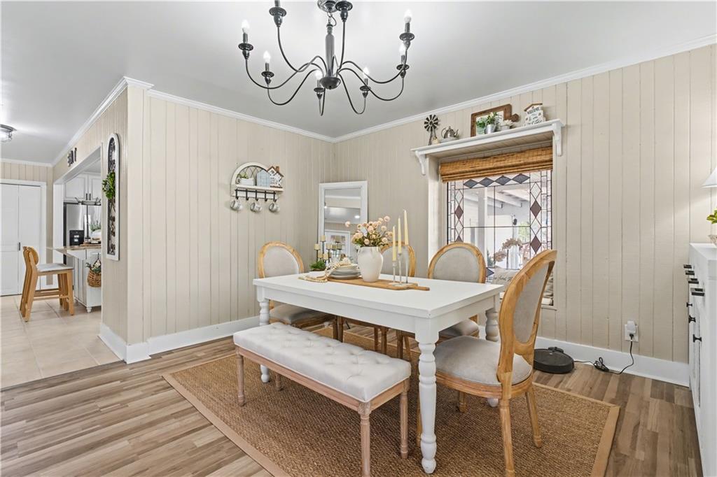 1833 Tom Odum Road Vidalia, GA 30474 - Photo 19 of 59 a view of a dining room with furniture and wooden floor