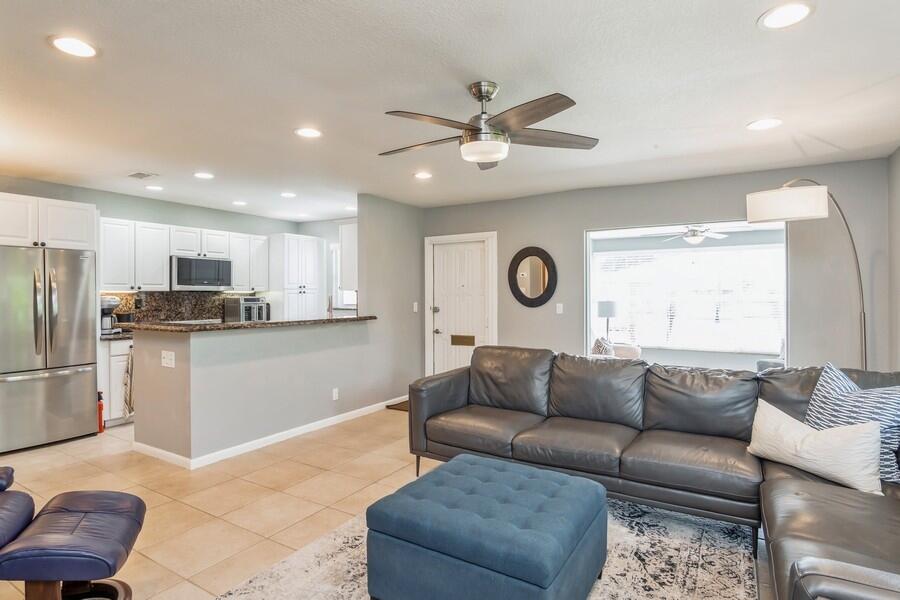 1230 South Drive Way, Unit A Delray Beach, FL 33445 - Photo 11 of 26 a living room with furniture and kitchen view