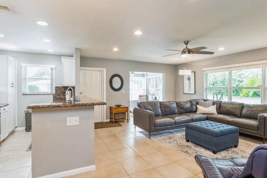 1230 South Drive Way, Unit A Delray Beach, FL 33445 - Photo 12 of 26 a living room with a couch and a large window