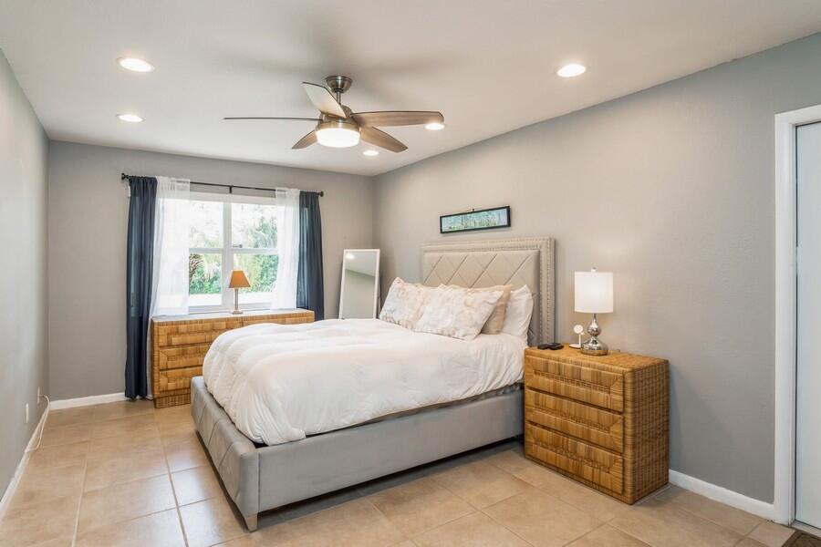 1230 South Drive Way, Unit A Delray Beach, FL 33445 - Photo 14 of 26 a bedroom with a bed and window