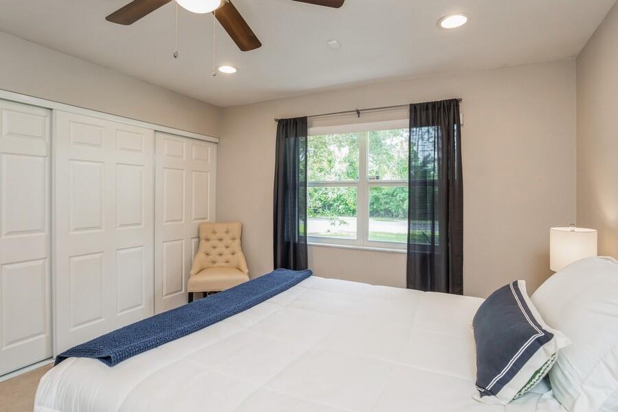 1230 South Drive Way, Unit A Delray Beach, FL 33445 - Photo 20 of 26 a bedroom with a bed and a window