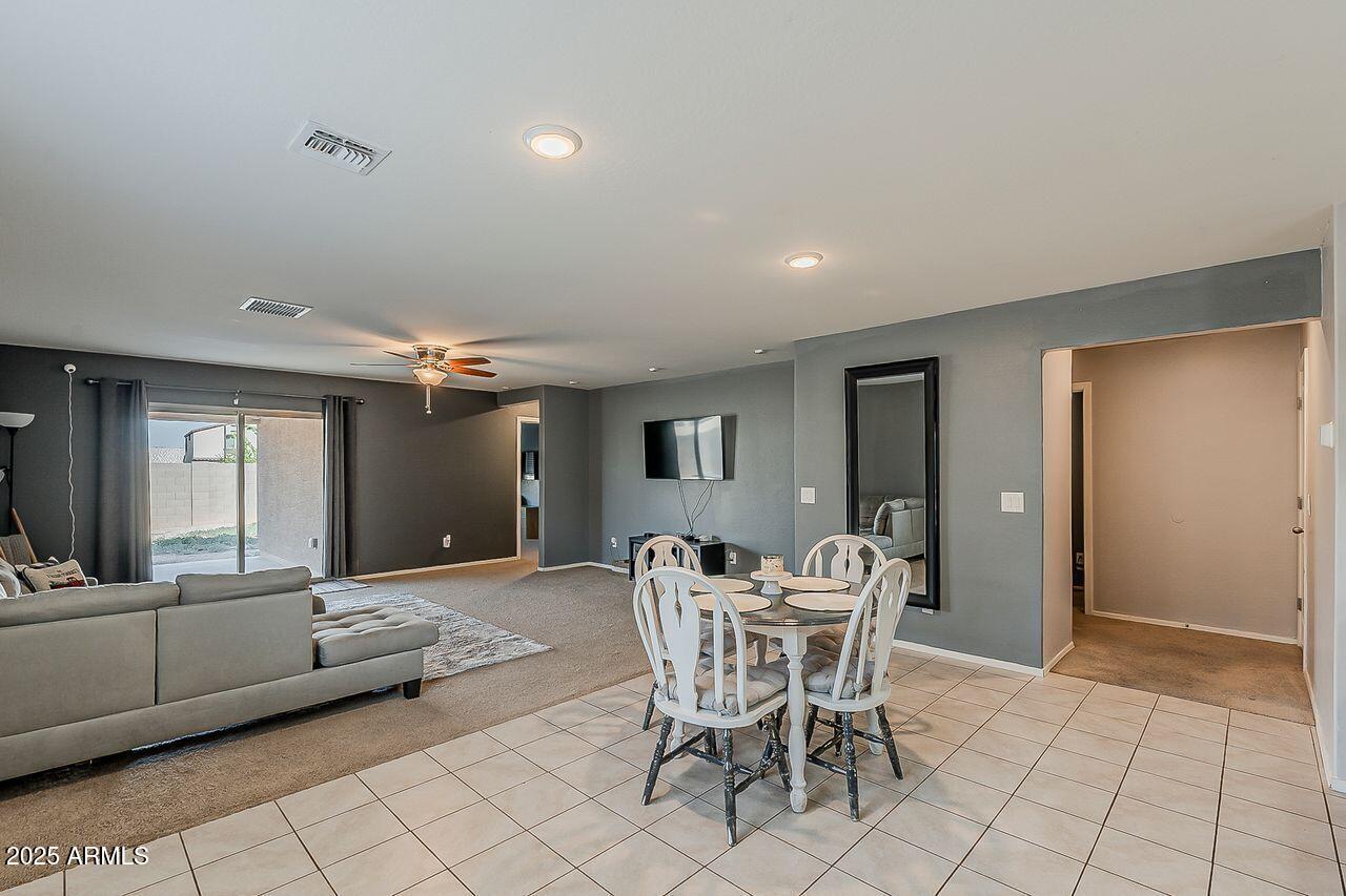 8721 South 253rd Drive Buckeye, AZ 85326 - Photo 11 of 44 a dining room with furniture and window