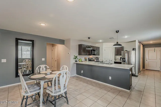 a dining room with furniture and window