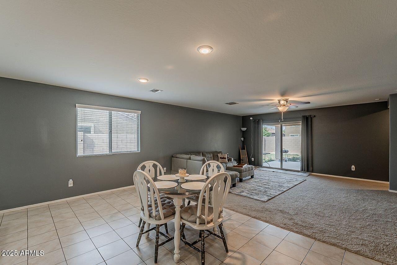 8721 South 253rd Drive Buckeye, AZ 85326 - Photo 13 of 44 a dining room with furniture and window