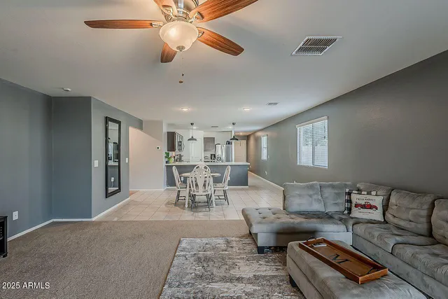 a living room with furniture rug and window