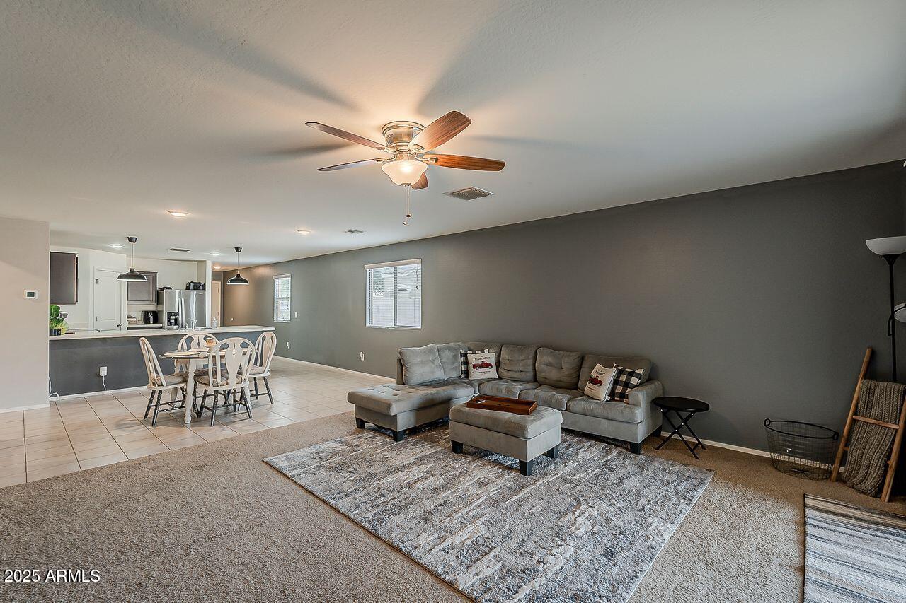 8721 South 253rd Drive Buckeye, AZ 85326 - Photo 17 of 44 a living room with furniture rug and window