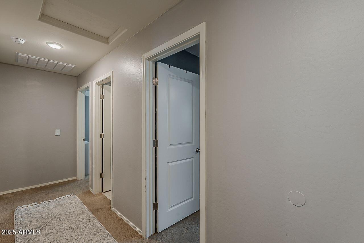 8721 South 253rd Drive Buckeye, AZ 85326 - Photo 23 of 44 a view of hallway with closet