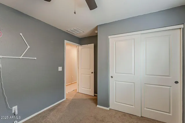a livingroom with workspace and a window