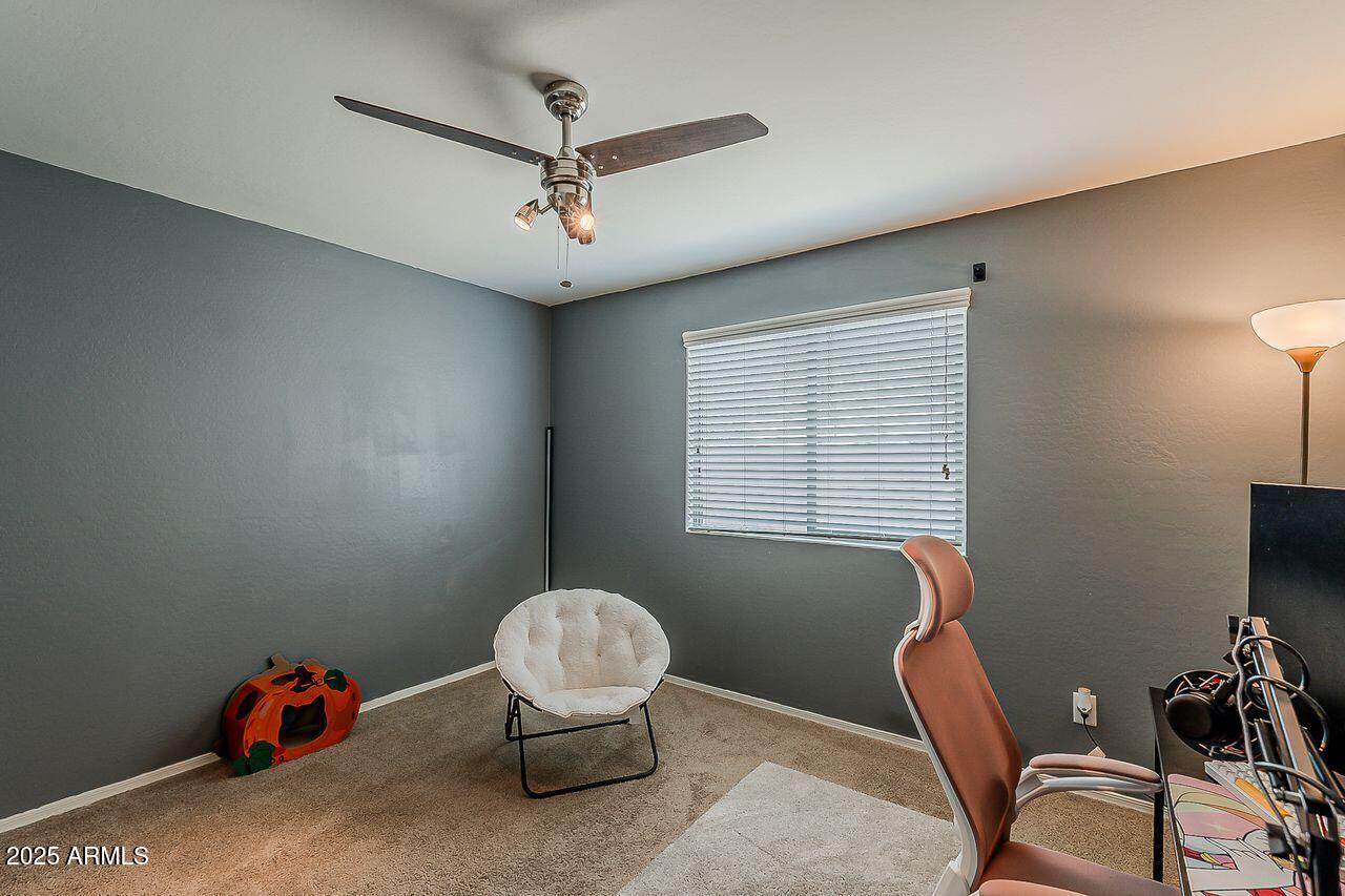 8721 South 253rd Drive Buckeye, AZ 85326 - Photo 26 of 44 a livingroom with workspace and a window