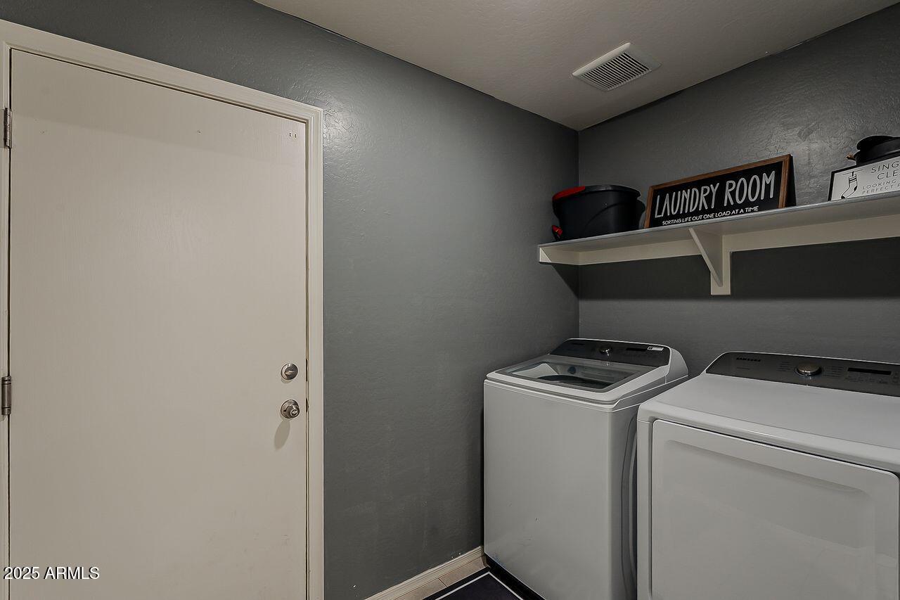 8721 South 253rd Drive Buckeye, AZ 85326 - Photo 30 of 44 a utility room with dryer and washer