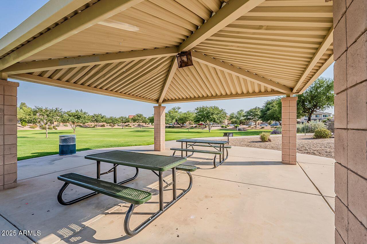8721 South 253rd Drive Buckeye, AZ 85326 - Photo 38 of 44 a view of a tables and chairs under an umbrella