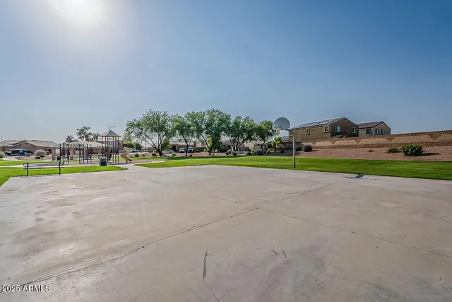 a blue bed sitting in a room next to a window