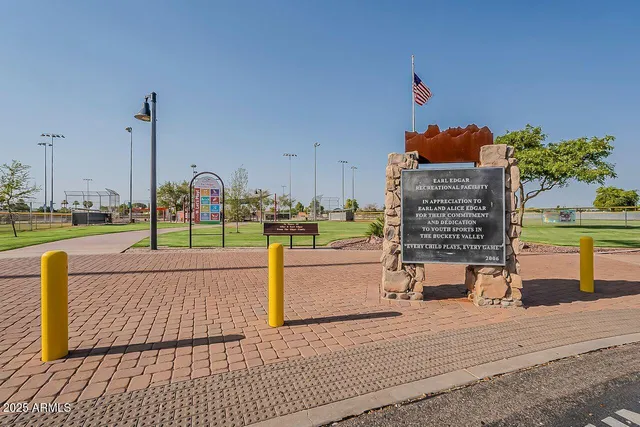 a view of a park with large trees