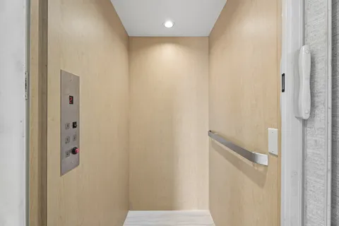 a spacious bathroom with a granite countertop sink a mirror and a shower