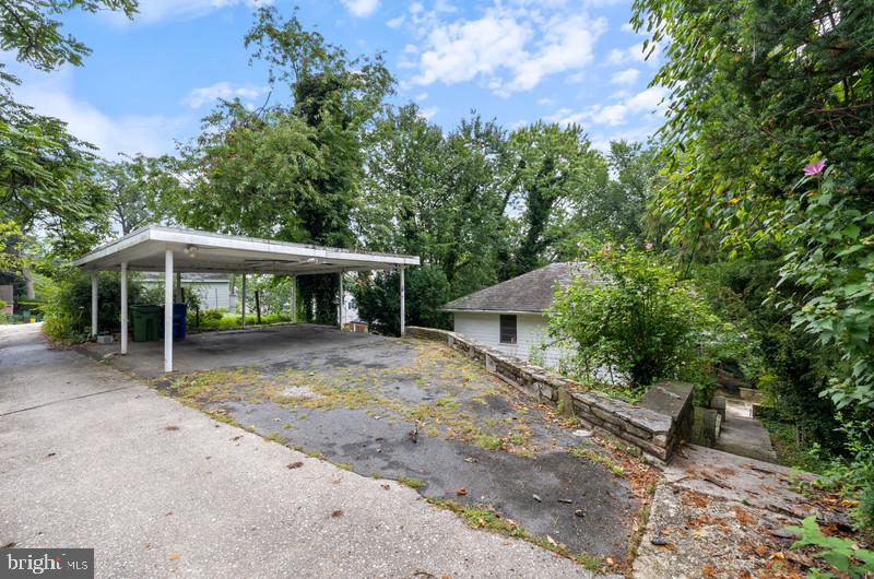 4109 Westview Road Baltimore, MD 21218 - Photo 32 of 35 a view of a house with a yard and large tree