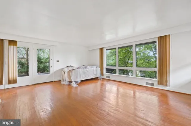 a view of room with window and hardwood floor