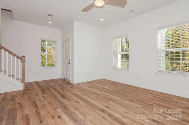 a view of a kitchen with a sink and a refrigerator
