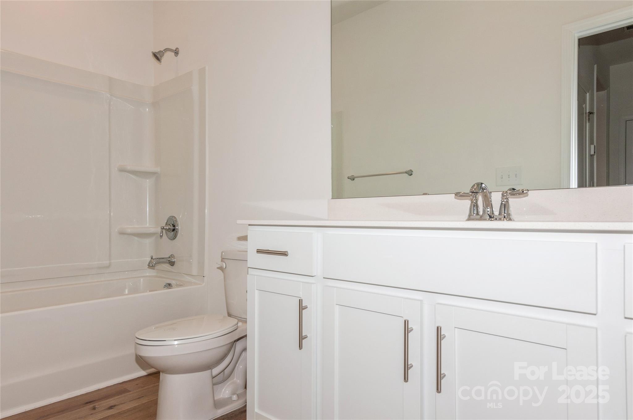 6006 Cedar Chip Way Matthews, NC 28105 - Photo 26 of 35 a bathroom with a sink a toilet and shower