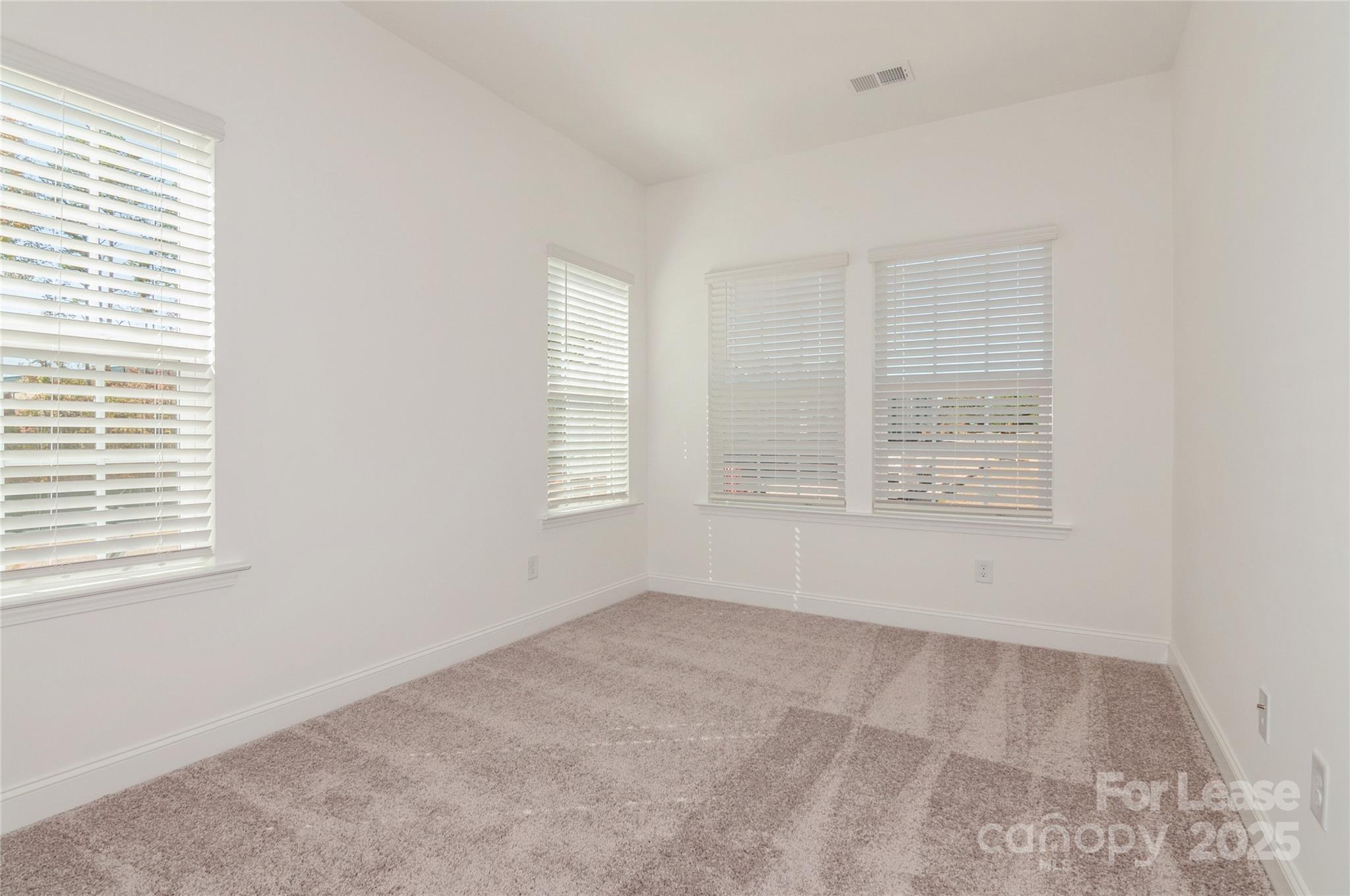 6006 Cedar Chip Way Matthews, NC 28105 - Photo 29 of 35 an empty room with windows