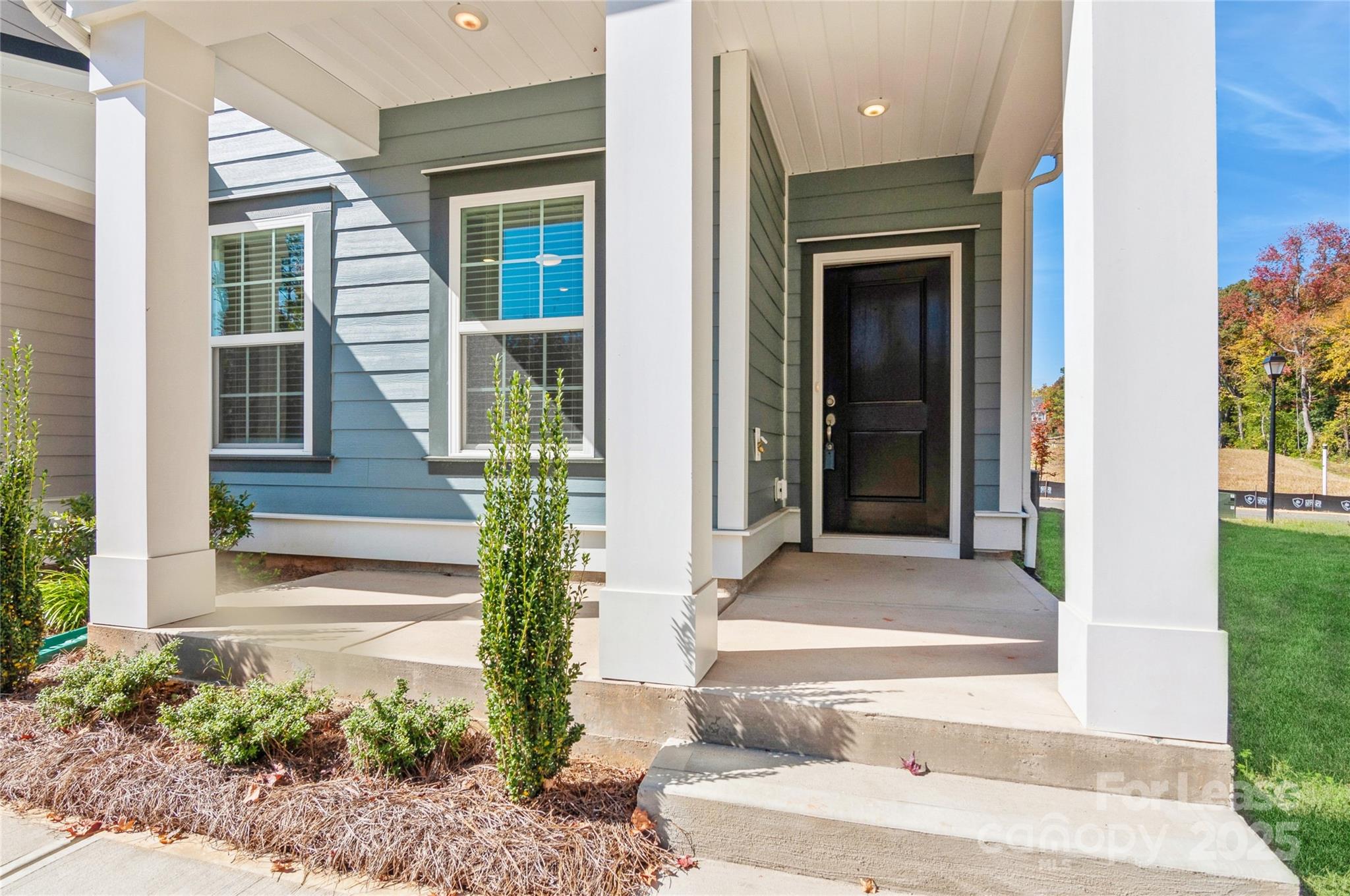 6006 Cedar Chip Way Matthews, NC 28105 - Photo 7 of 35 a front view of a house with a porch