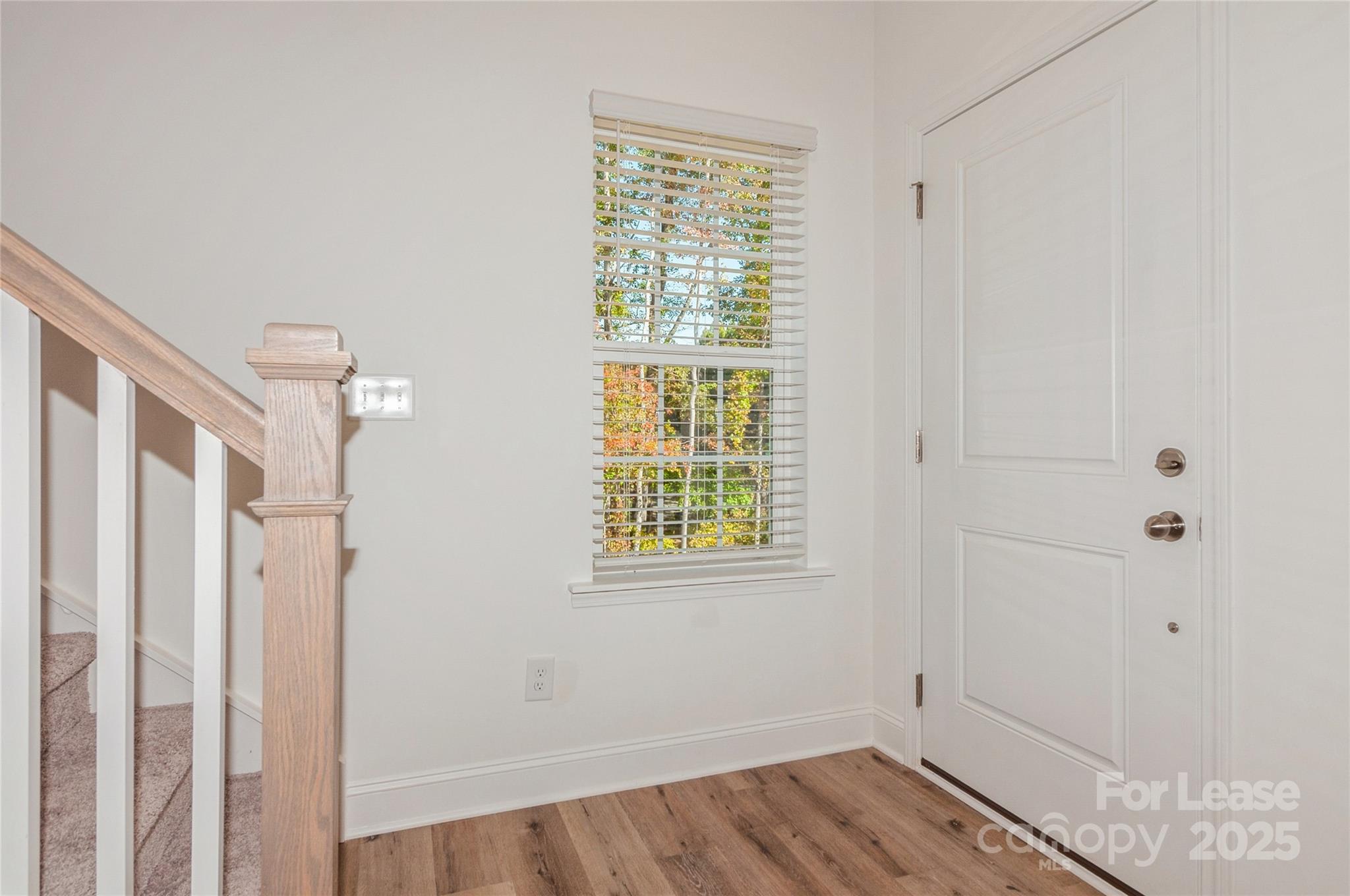 6006 Cedar Chip Way Matthews, NC 28105 - Photo 10 of 35 a view of a room with wooden floor and windows