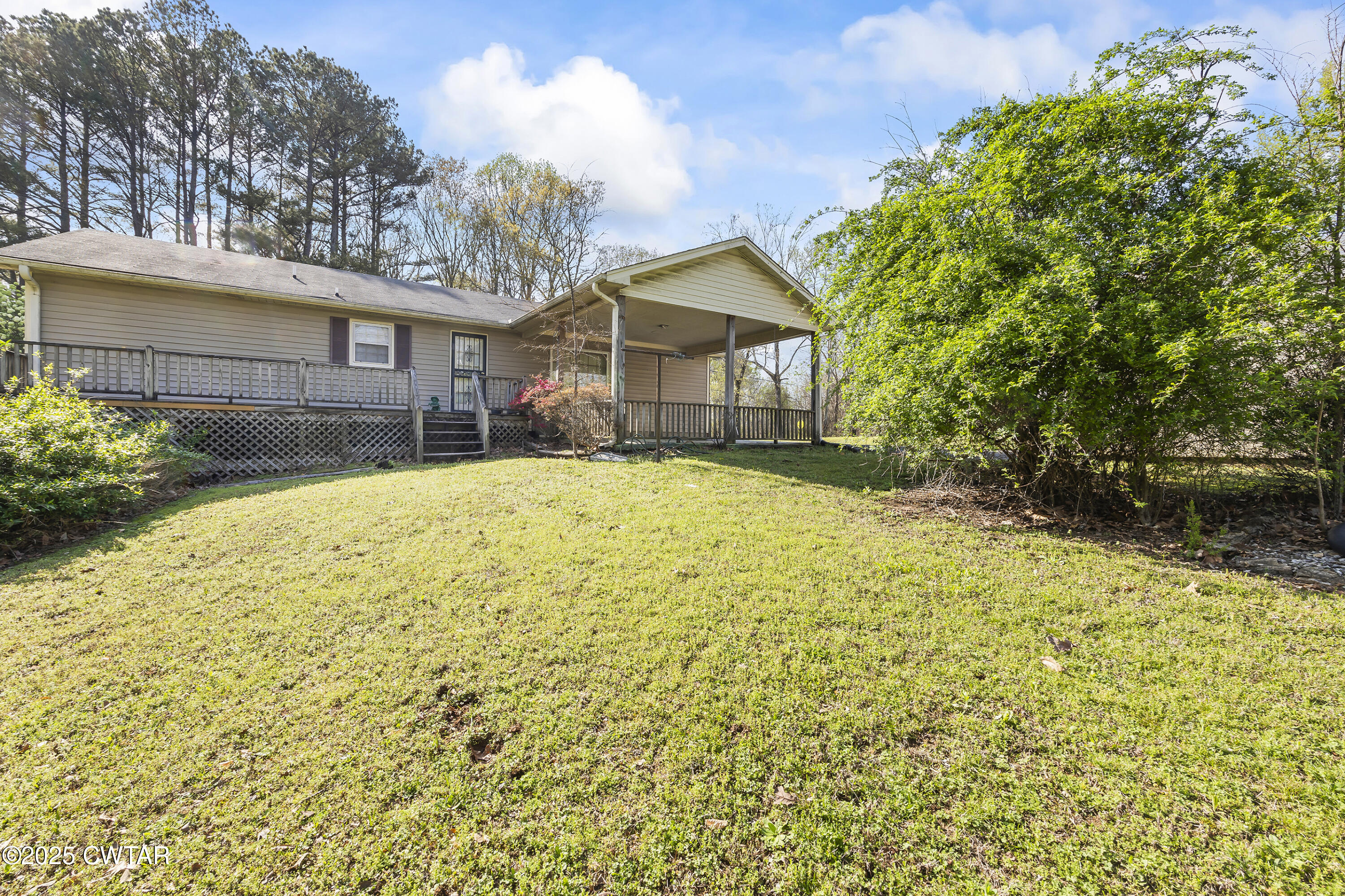 325 Deep Gap Road Jackson, TN 38301 - Photo 1 of 19 a view of a house with a yard