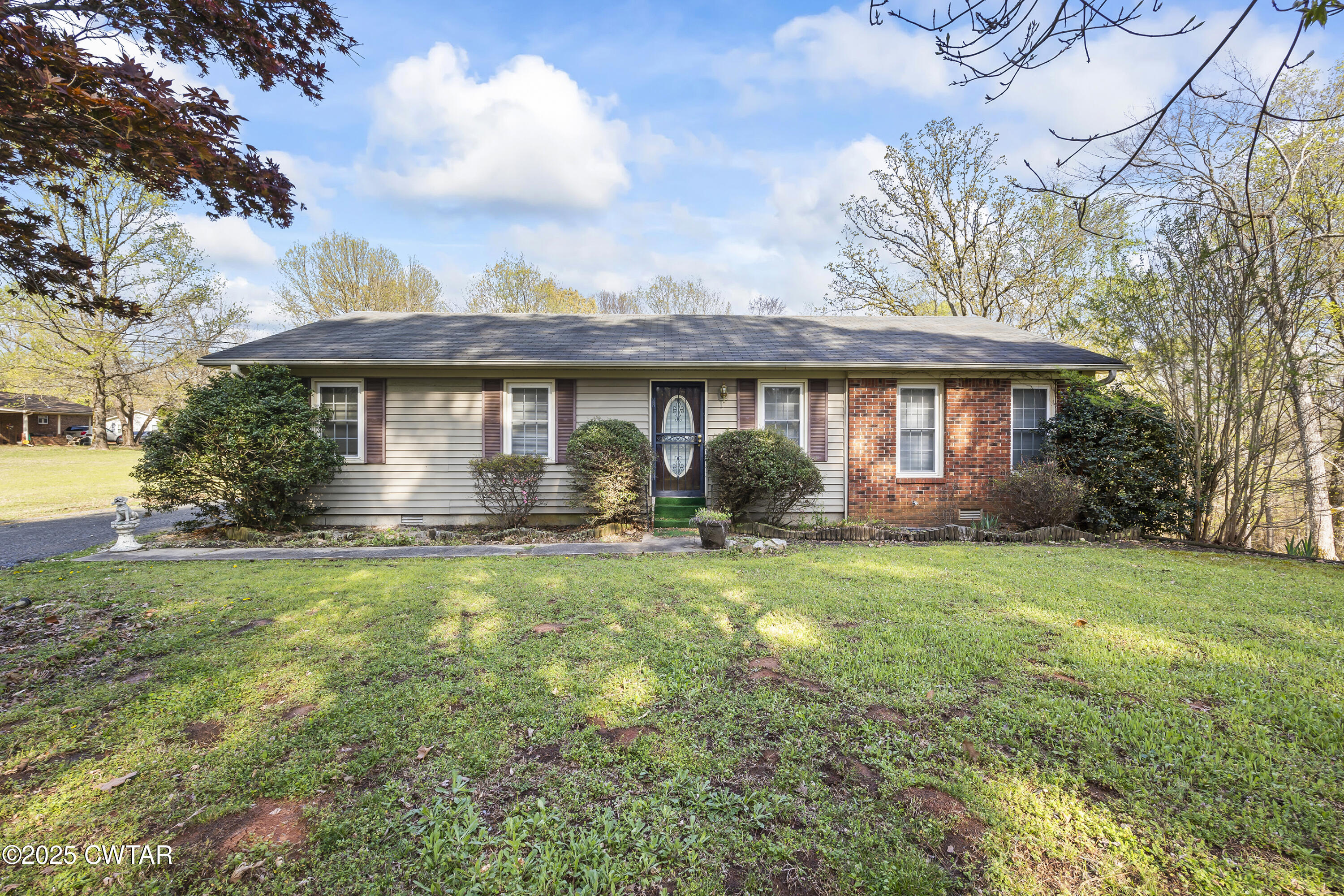325 Deep Gap Road Jackson, TN 38301 - Photo 18 of 19 a view of a house with backyard sitting area and garden