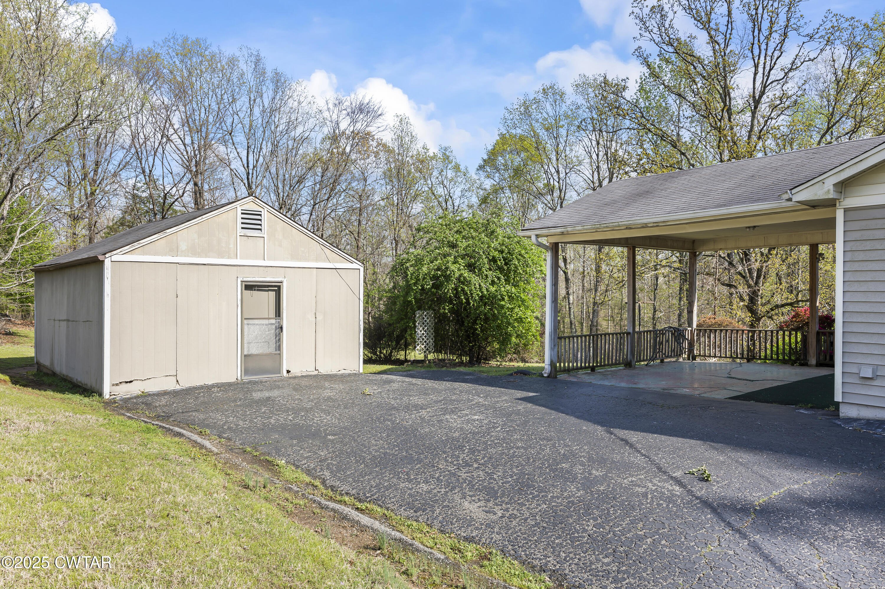 325 Deep Gap Road Jackson, TN 38301 - Photo 2 of 19 a front view of a house with a yard and garage
