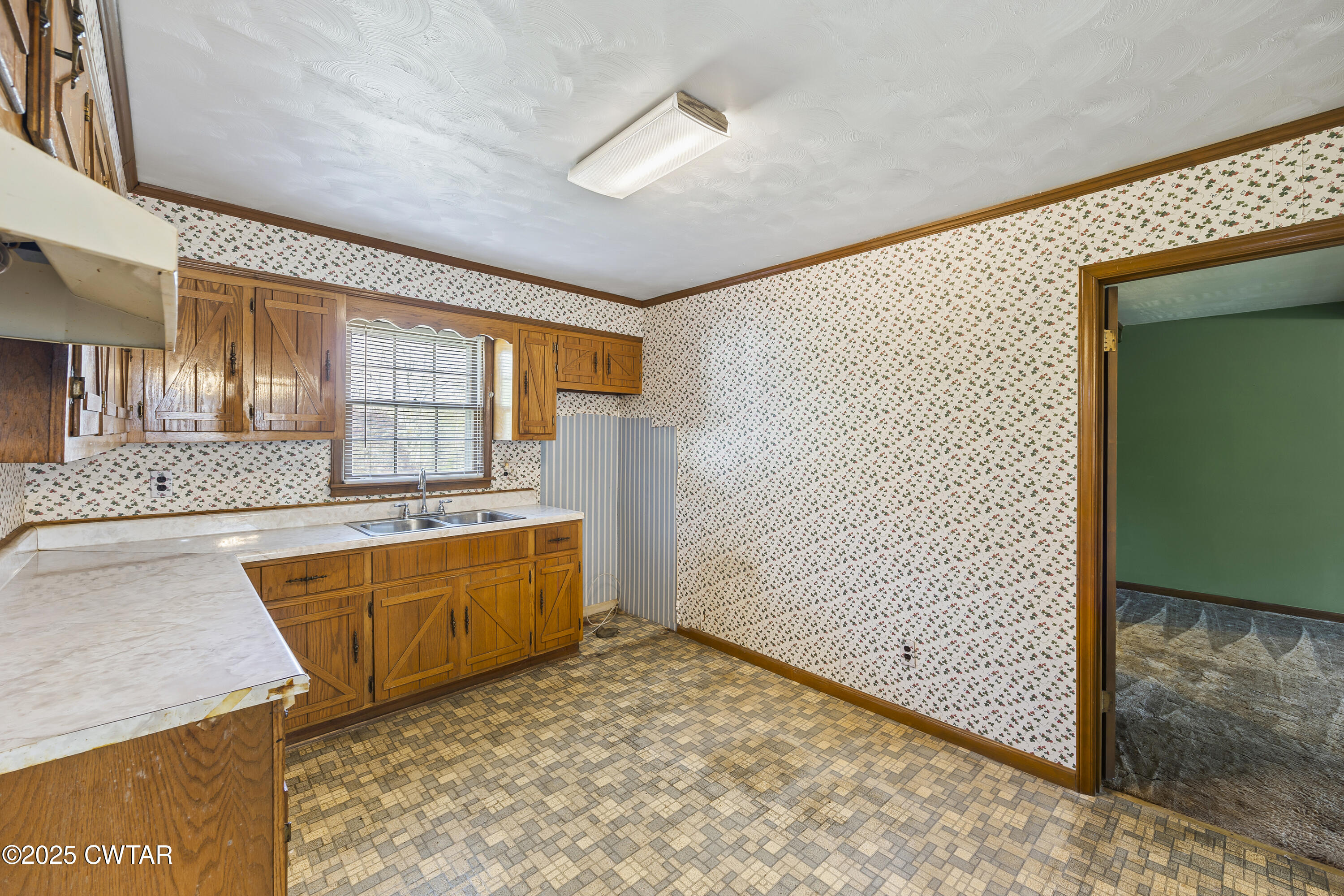 325 Deep Gap Road Jackson, TN 38301 - Photo 6 of 19 a view of a kitchen with a sink and cabinets
