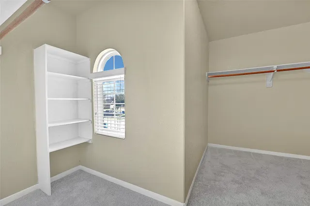 a view of a closet with cabinet