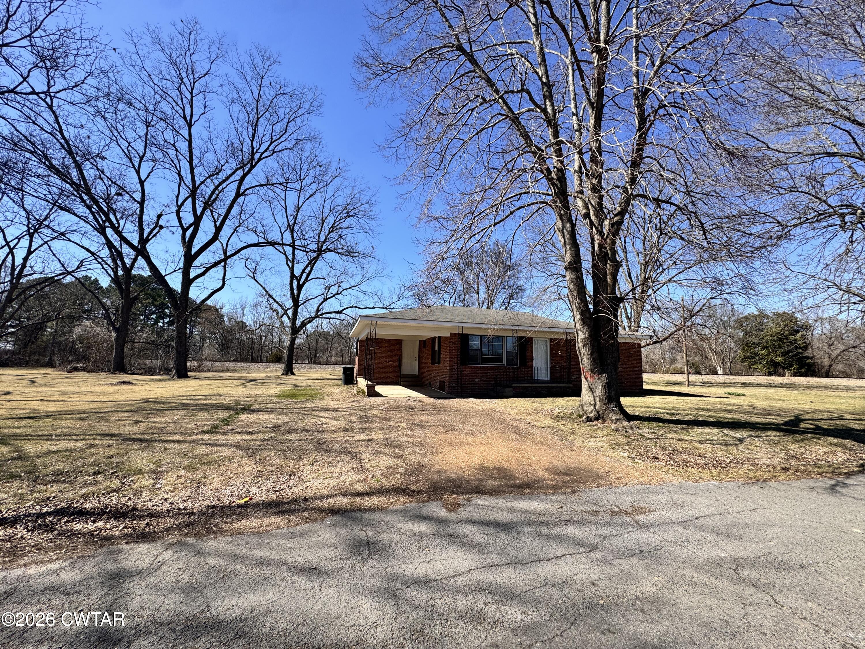 567 North Church Street Rives, TN 38253 - Photo 13 of 17 a house with trees in front of it