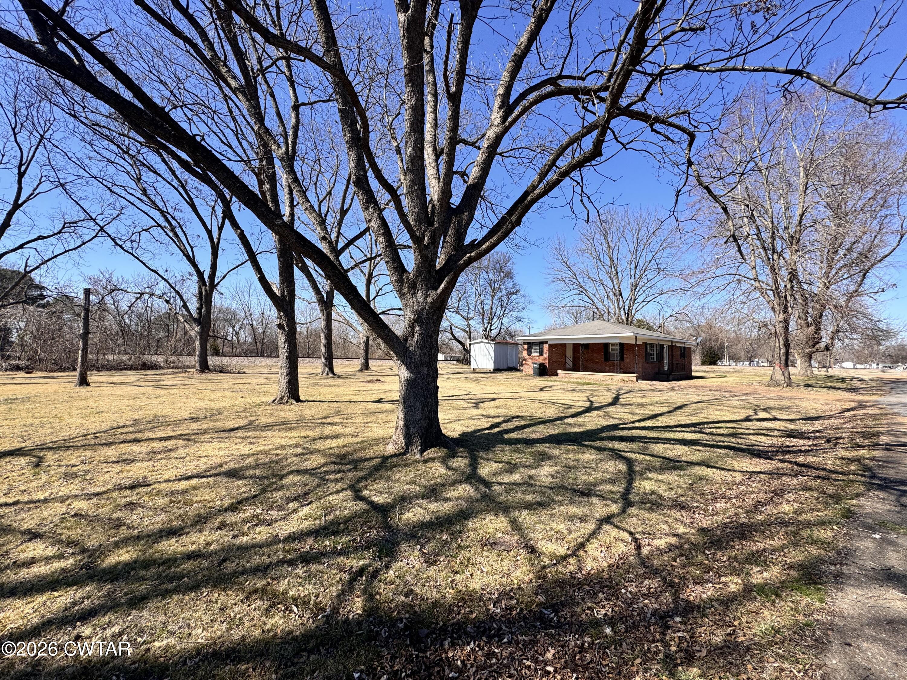 567 North Church Street Rives, TN 38253 - Photo 14 of 17 a house with trees in the background