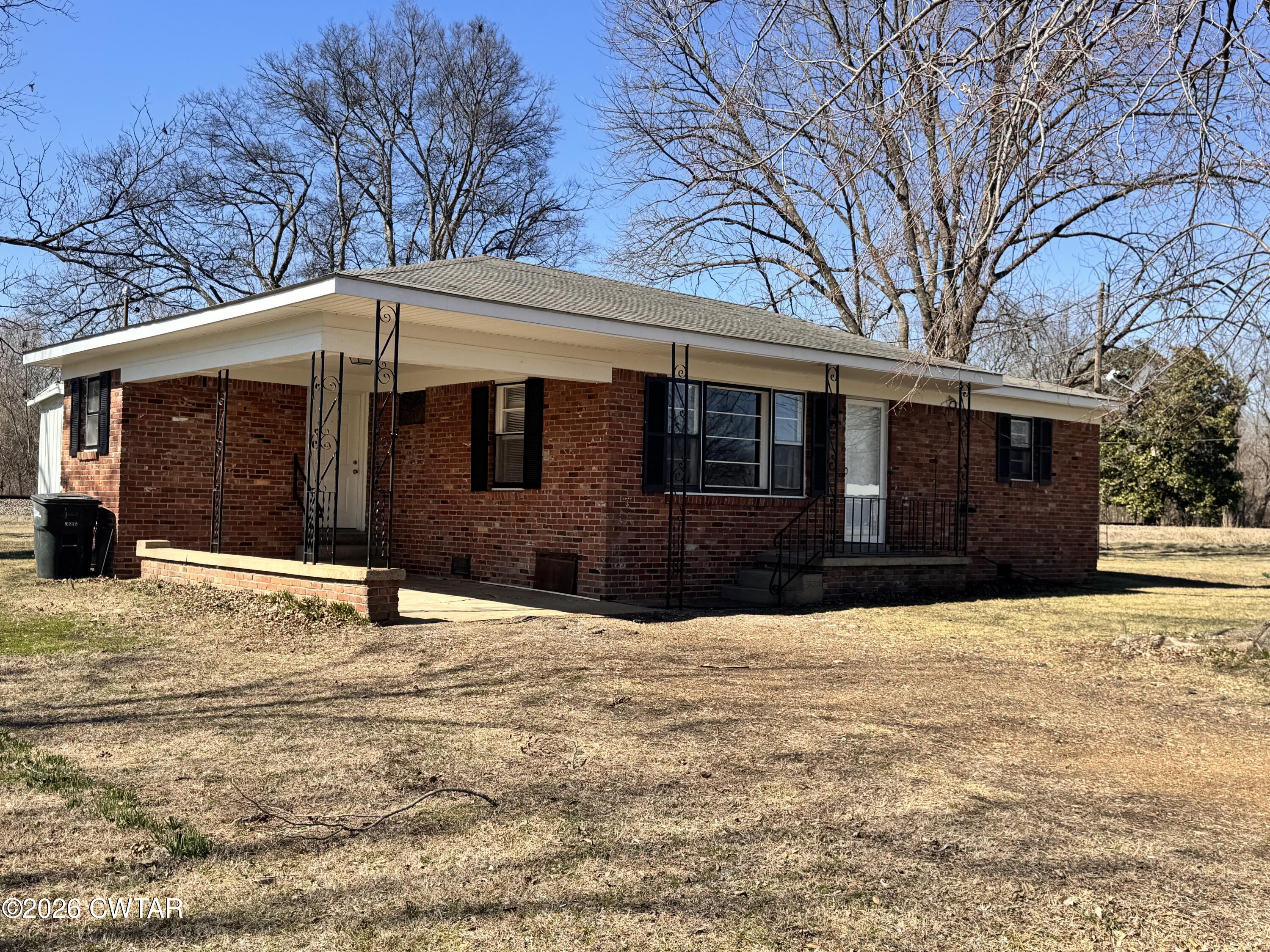 567 North Church Street Rives, TN 38253 - Photo 2 of 17 a front view of a house with a yard covered in snow