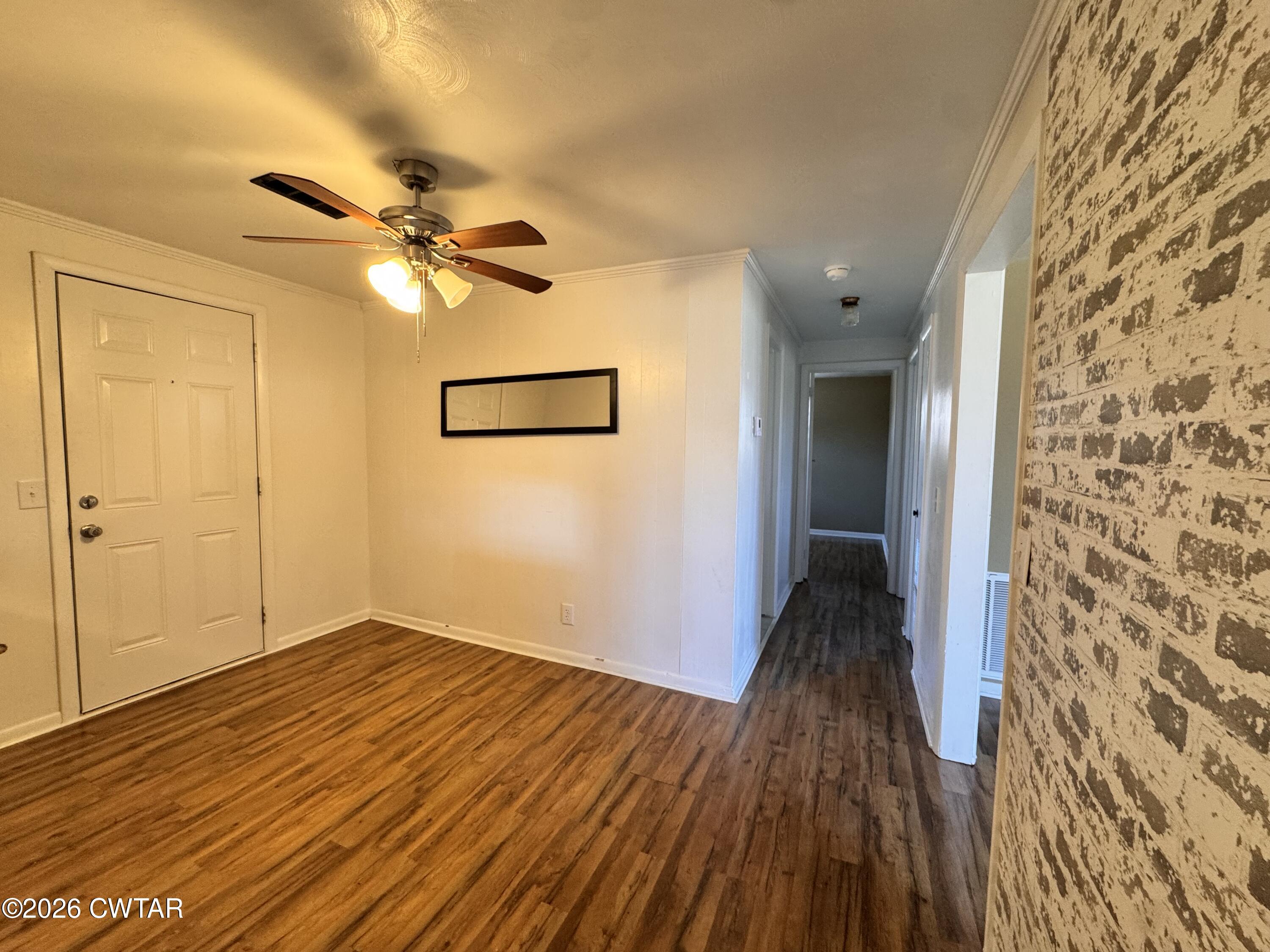 567 North Church Street Rives, TN 38253 - Photo 5 of 17 wooden floor in an empty room with a window
