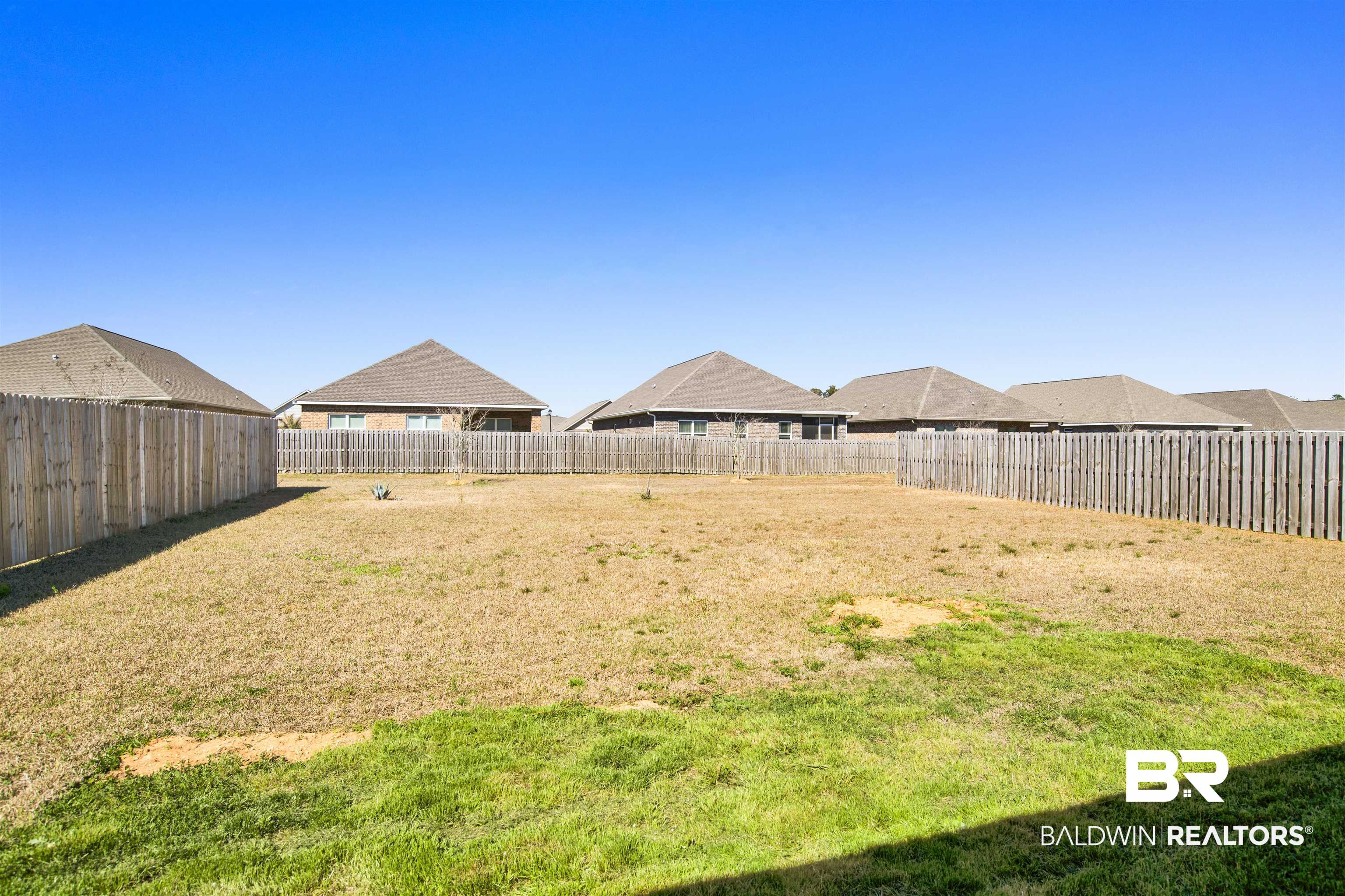 1174 Pheasant Circle Foley, AL 36535 - Photo 25 of 29 Fenced backyard with a residential view