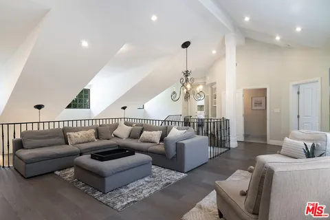 a bedroom with a bed and a workspace