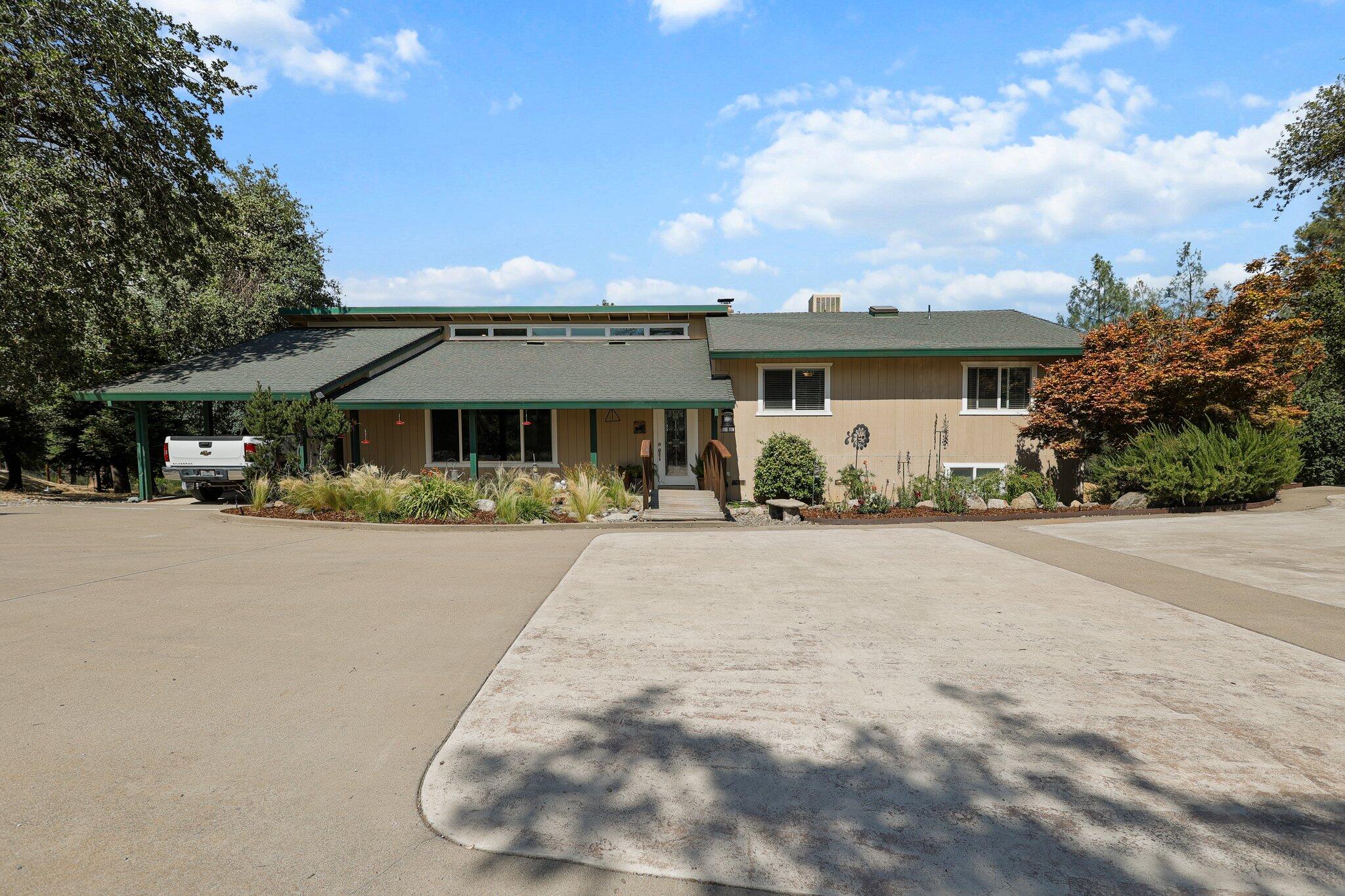 6949 Rector Creek Road Igo, CA 96047 - Photo 104 of 110 a front view of a house with basket ball court and outdoor seating