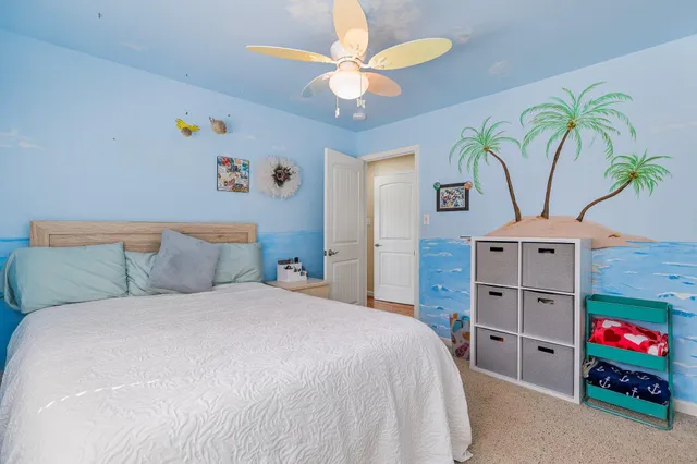 a view of a workspace with furniture and wooden floor