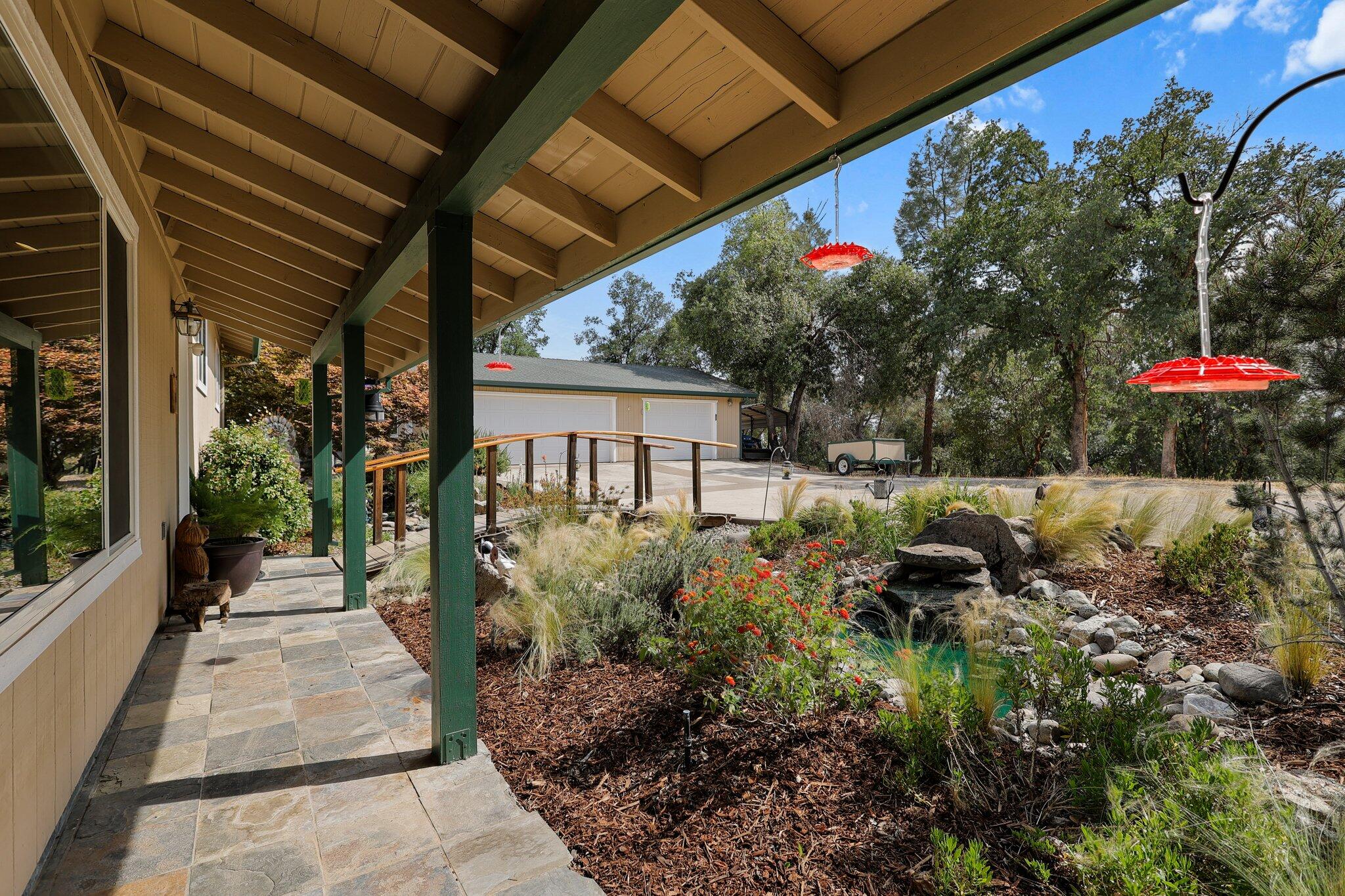 6949 Rector Creek Road Igo, CA 96047 - Photo 3 of 110 a view of a patio with table and chairs and potted plants