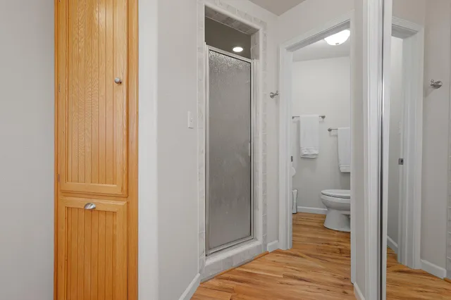 a bathroom with a toilet sink and a window