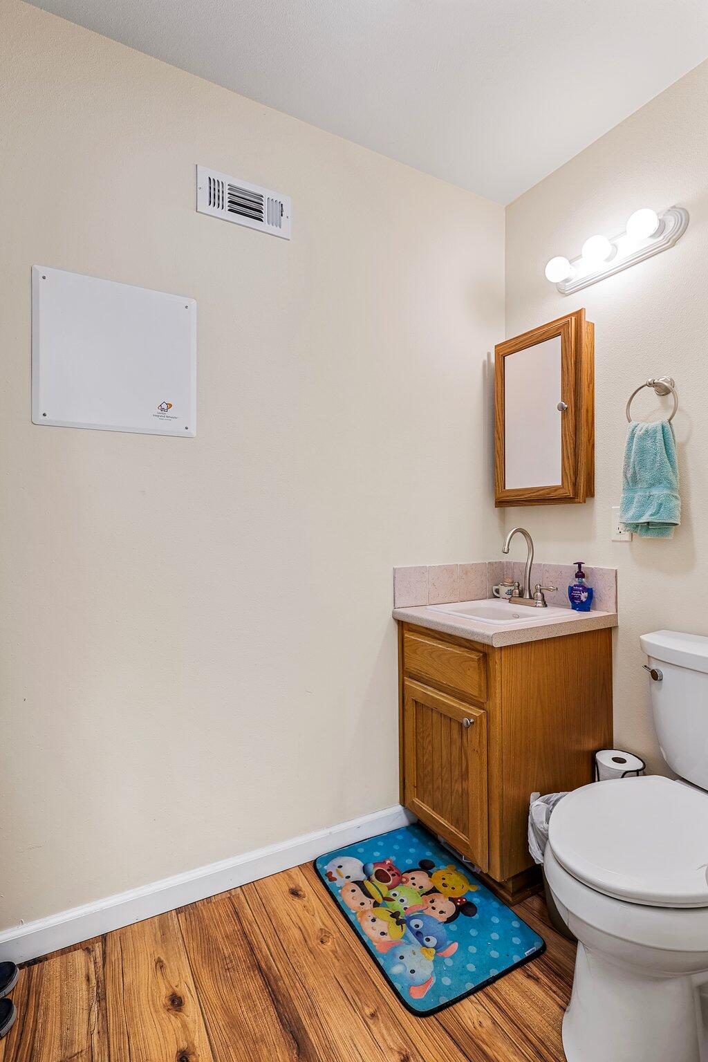 6949 Rector Creek Road Igo, CA 96047 - Photo 36 of 110 a bathroom with a sink a toilet and mirror