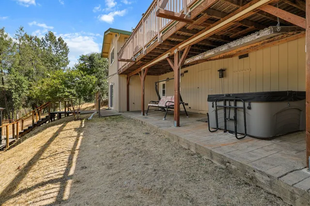 a front view of a house with basket ball court and outdoor seating